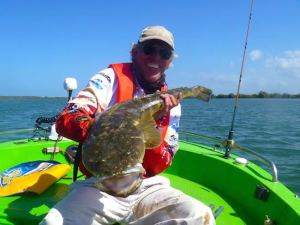 Boat Gold Coast john with his 94.5cm flathead we caught during the flathead classic 2014 which won longest flathead on a hard body lure. it was taken in tipplers passage